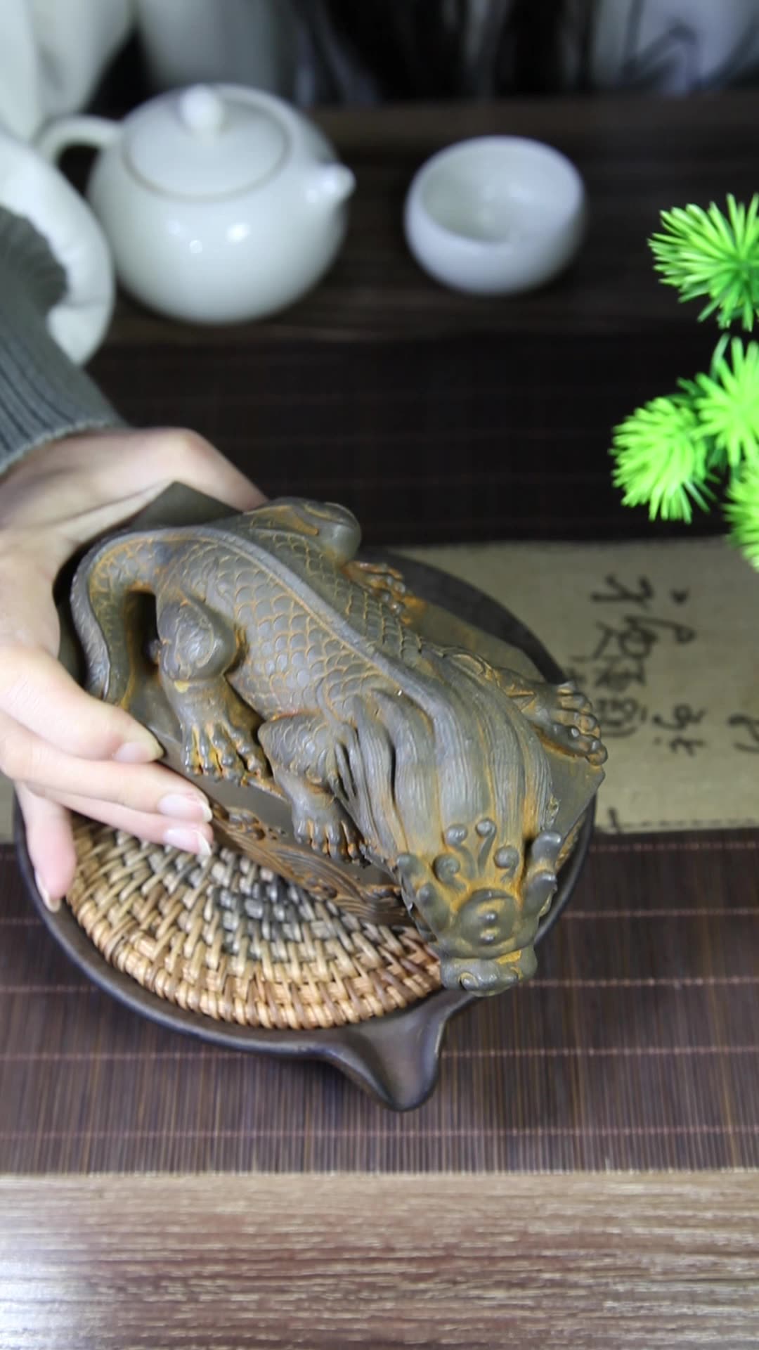 An iron-cast desktop figure in the Chinese style that depicts the water-repelling mythical beast "Gong Fu," signifying harmony and protection from water-related disasters