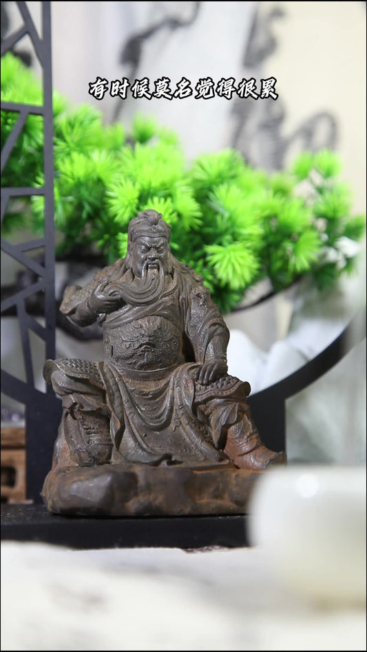 An iron-cast desktop figurine of Guan Yu (Lord Guan), the Martial Sage, in the Chinese style.